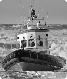A lifeboat crashing through sea waves