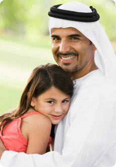 Arabic father hugging daughter