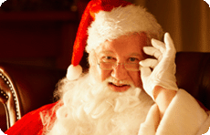 Saint Nicholas in full Santa outfit adjusting his specs