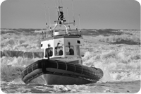 A lifeboat crashing through sea waves