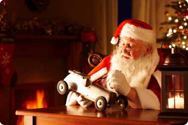 Saint Nicholas hand painting a wooden toy car